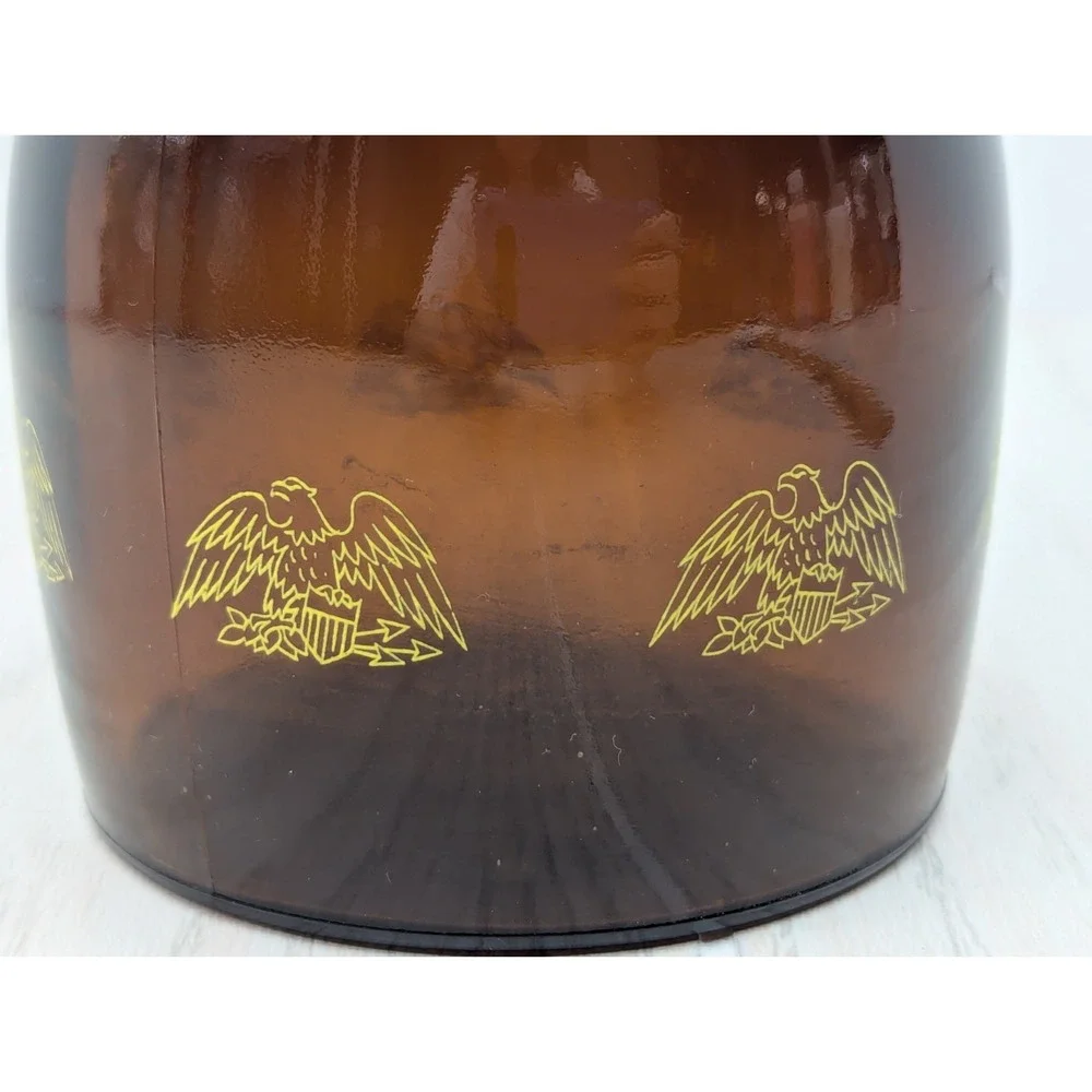 Log Cabin vintage syrup dispenser pitcher amber glass yellow lid patriotic eagle